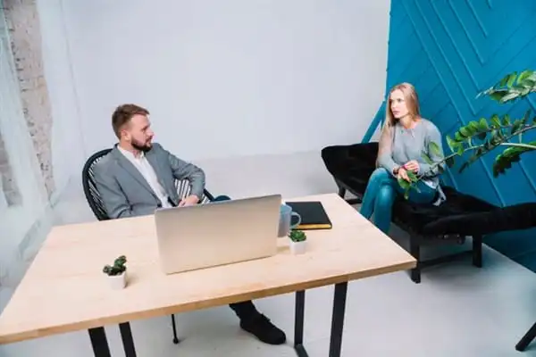 Therapist and client in a counseling session for anxiety treatment.